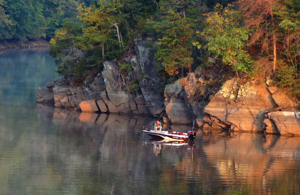 Someone boating on Philpott Lake