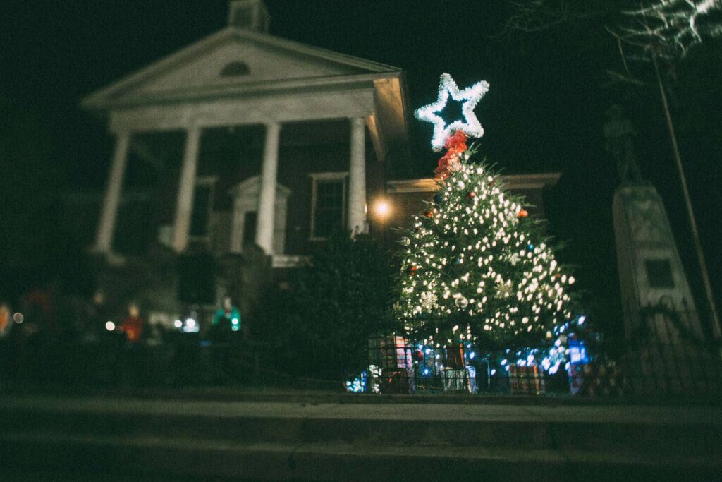 Christmas tree with star on top in front of courthouse
