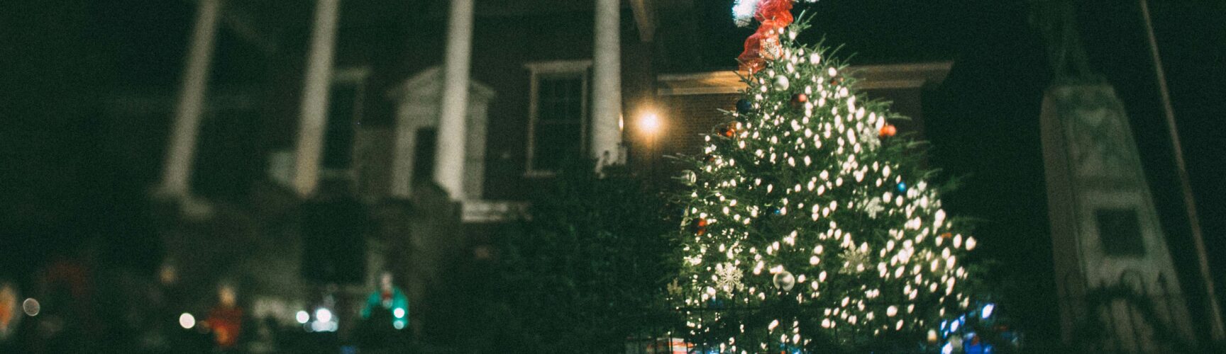 Christmas tree with star on top in front of courthouse