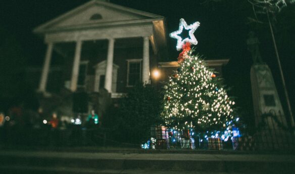 Christmas tree with star on top in front of courthouse